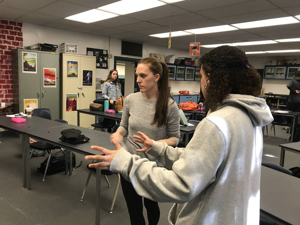 Dawn Minnick-Trujillo interacts with a student during a robotics class on March 13 at the Las Vegas Academy of the Arts where she teaches physics and works as a robotics coach. She's one of three ...