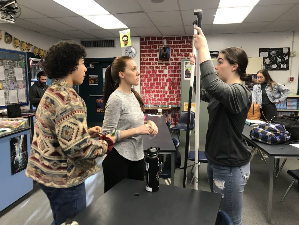 Dawn Minnick-Trujillo interacts with students during a robotics class on March 13 at the Las Vegas Academy of the Arts where she teaches physics and works as a robotics coach. She's one of three ...
