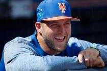 New York Mets' Tim Tebow laughs with teammates in the dugout before a spring training baseball game against the New York Yankees, Wednesday, March 7, 2018, in Port St. Lucie, Fla.. Tebow did not p ...