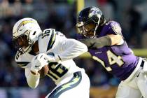 Los Angeles Chargers wide receiver Tyrell Williams, left, rushes past Baltimore Ravens cornerback Brandon Carr in the first half of an NFL wild card playoff football game, Sunday, Jan. 6, 2019, in ...