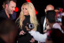 Britney Spears signs autographs during an event to announce her new residency at The Park Theater at Park MGM on Thursday, Oct. 18, 2018, outside T-Mobile Arena, in Las Vegas. (Benjamin Hager/Las ...