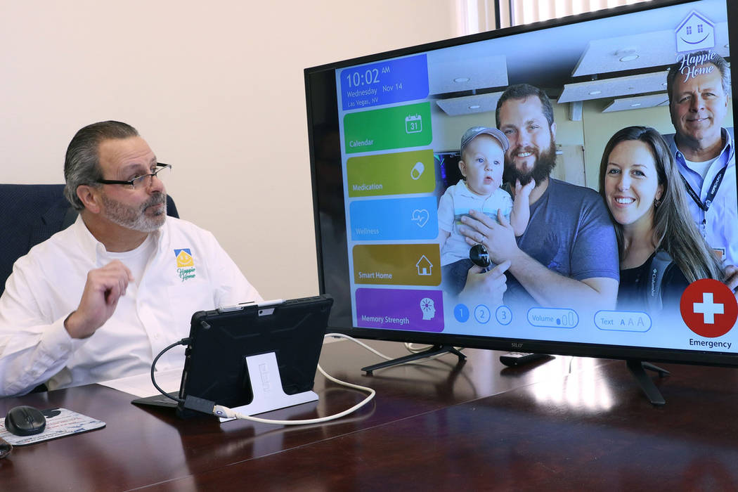 Anthony Rufo, president of HAPPIE Home, demonstrates how Happie Home, a new in-home digital companion, works at his Henderson office on Wednesday, Nov. 14, 2018. Happie Home is an in-home digital ...