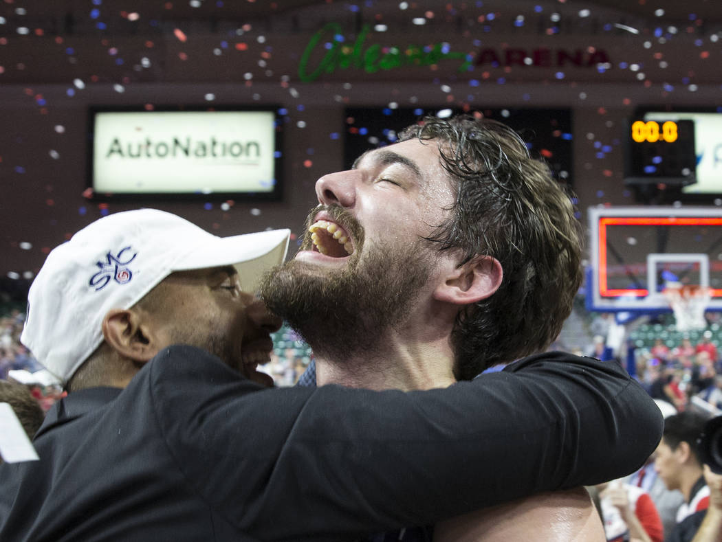 St. Mary's senior center Jordan Hunter, right, celebrates after the Gaels upset Gonzaga 60-47 to win the West Coast Conference championship on Tuesday, March 12, 2019, at Orleans Arena, in Las Veg ...