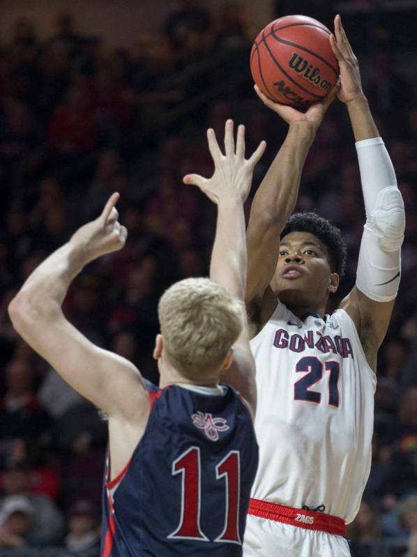 Gonzaga junior forward Rui Hachimura (21) shoots a corner three over St. Mary's freshman forward Matthias Tass (11) in the first half during the West Coast Conference finals game on Tuesday, March ...