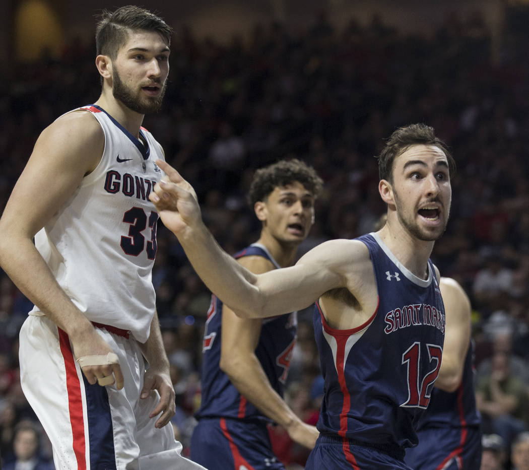 St. Mary's sophomore guard Tommy Kuhse (12) lobbies for a call as Gonzaga junior forward Killian Tillie (33) looks on in the second half during the West Coast Conference finals game on Tuesday, M ...