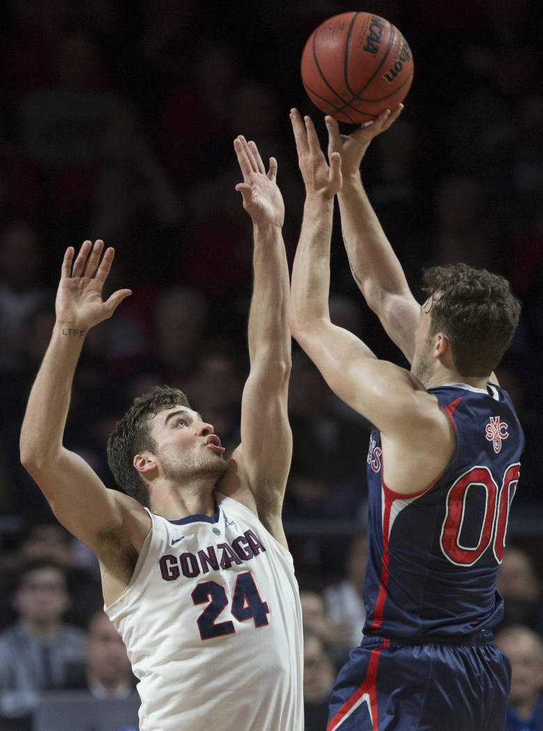 Gonzaga sophomore forward Corey Kispert (24) contests the shot of St. Mary's junior guard Tanner Krebs (00) in the first half during the West Coast Conference finals game on Tuesday, March 12, 201 ...
