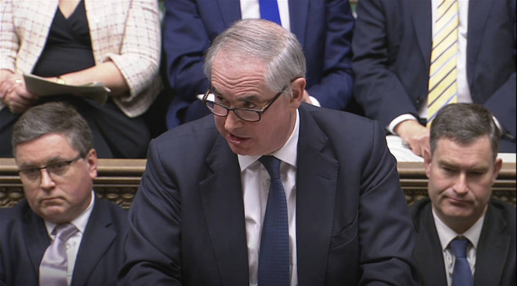 In this grab taken from video, Britain's Attorney General Geoffrey Cox gives his legal opinion during the Brexit debate in the House of Commons, in London, Tuesday March 12, 2019. Cox said changes ...