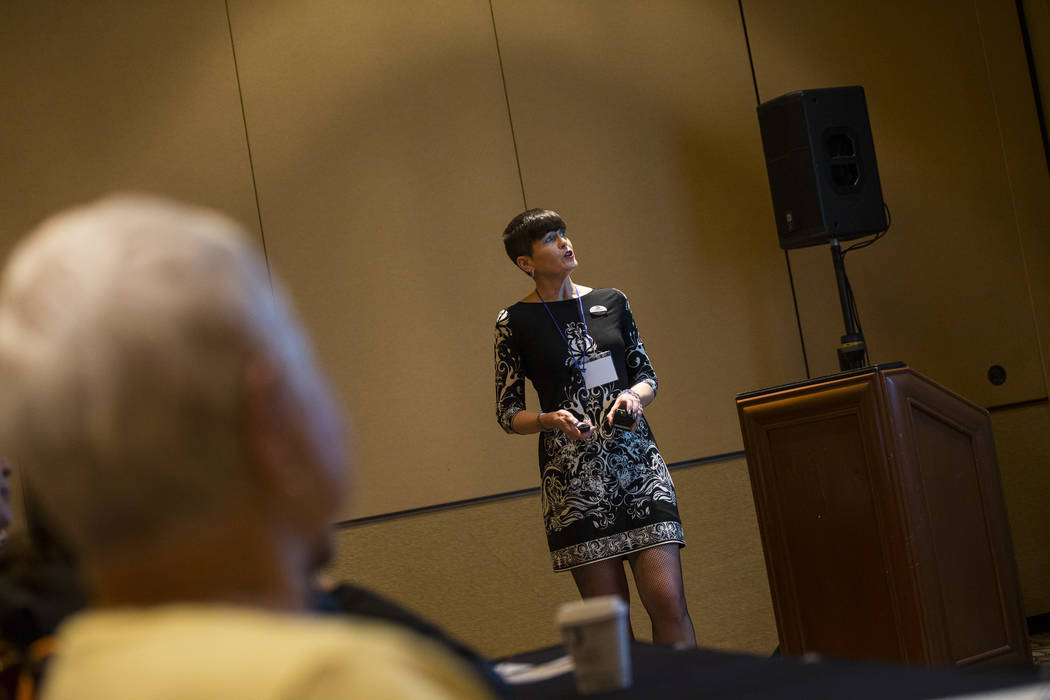 Faith Alchorn-Selk, a sales support representative with Prestige Travel, talks about different travel opportunities and cruises during the fifth annual AgeWell Expo at the Rio Convention Center in ...