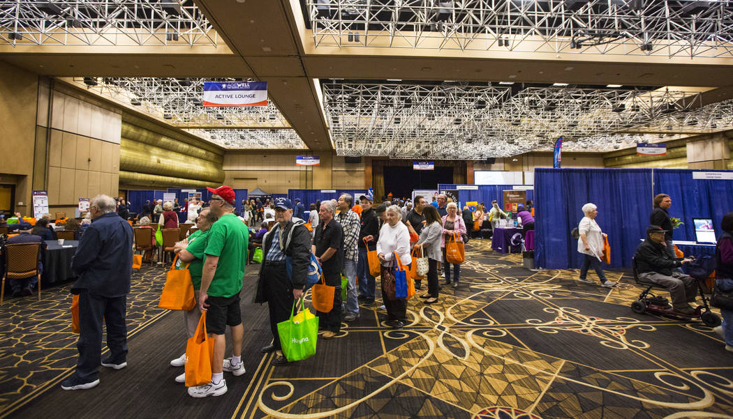 Attendees line up for a travel giveaway during the fifth annual AgeWell Expo at the Rio Convention Center in Las Vegas on Saturday, March 16, 2019. (Chase Stevens/Las Vegas Review-Journal) @csstev ...