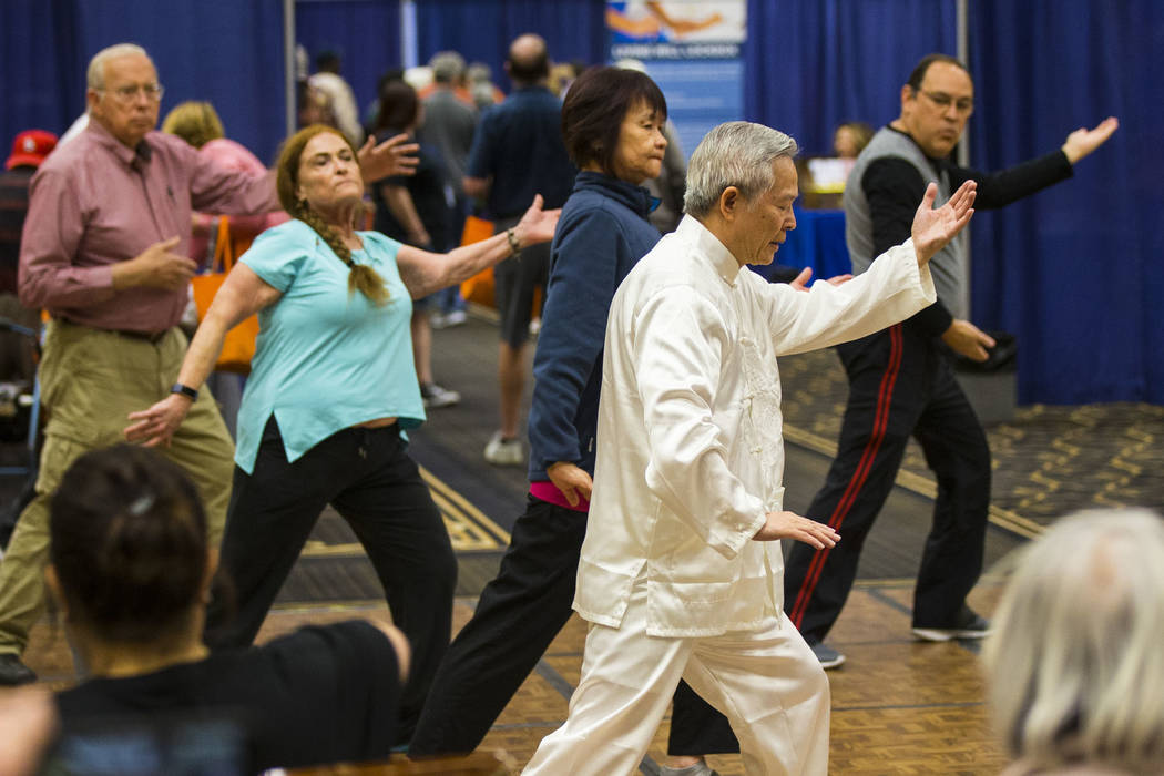 David Ou-Yang leads a beginners session in tai chi and qigong during the fifth annual AgeWell Expo at the Rio Convention Center in Las Vegas on Saturday, March 16, 2019. (Chase Stevens/Las Vegas R ...