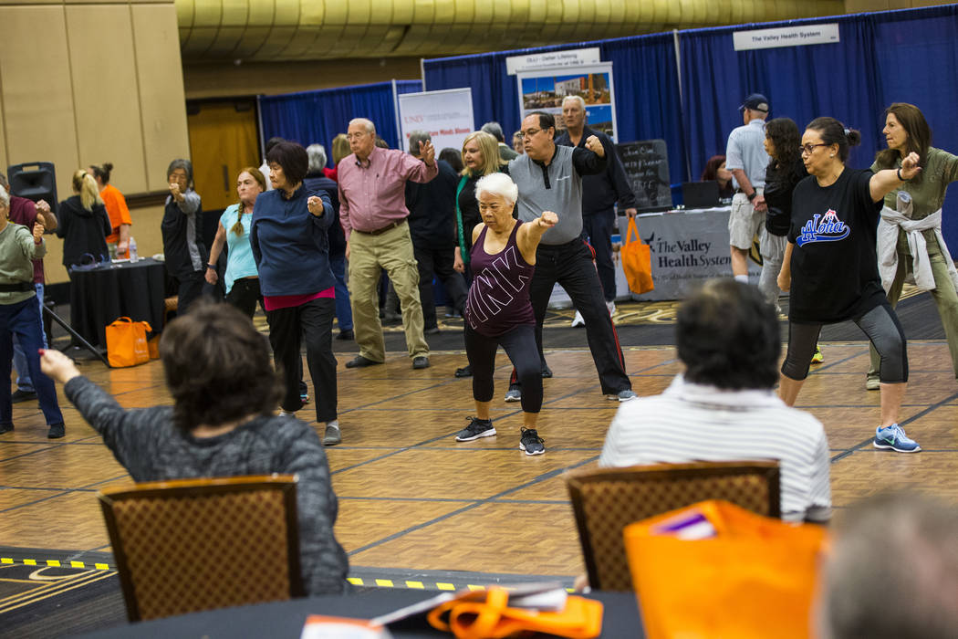 Attendees participate in a tai chi and qigong class during the fifth annual AgeWell Expo at the Rio Convention Center in Las Vegas on Saturday, March 16, 2019. (Chase Stevens/Las Vegas Review-Jour ...