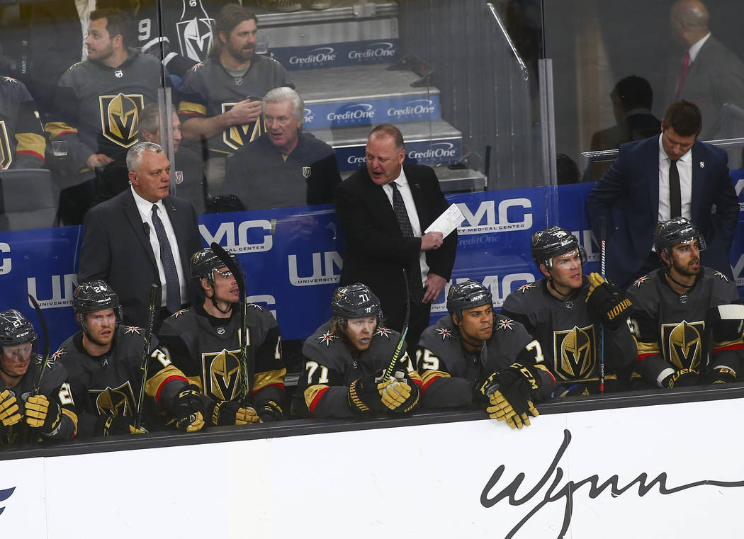Golden Knights head coach Gerard Gallant, center, reacts during the third period of an NHL hockey game against the Winnipeg Jets at T-Mobile Arena in Las Vegas on Friday, Feb. 22, 2019. (Chase Ste ...