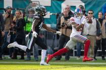 New York Giants wide receiver Odell Beckham Jr. catches the pass with Philadelphia Eagles cornerback DeVante Bausby defending during the first half of the NFL football game, Sunday, Nov. 25, 2018, ...