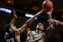 Grand Canyon guard Damari Milstead (11) takes a shot while being guarded by Seattle guard Terrell Brown (23) in the first half of the opening round of the Western Athletic Conference tournament in ...