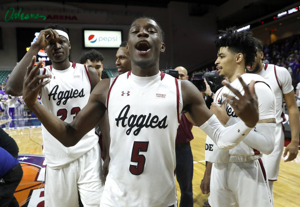 New Mexico State guard Clayton Henry (5) celebrates with teammates after New Mexico State defeated Grand Canyon 89-57 in an NCAA college basketball game for the Western Athletic Conference men's t ...