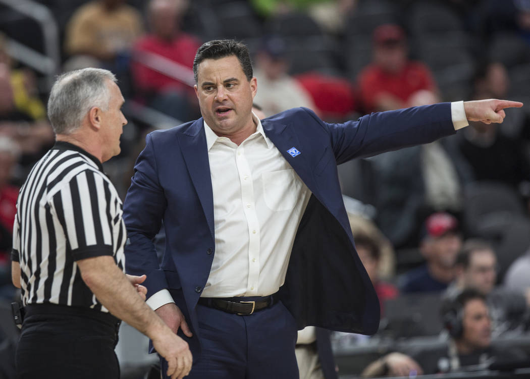 Arizona head coach Sean Miller, right, argues a call in the first half during the Wildcats Pac-12 tournament game with USC on Wednesday, March 13, 2019, at T-Mobile Arena, in Las Vegas. (Benjamin ...