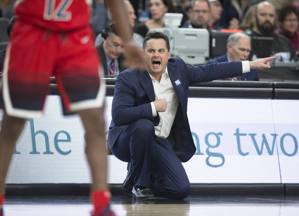 Arizona head coach Sean Miller, right, calls out a play in the first half during the Wildcats Pac-12 tournament game with USC on Wednesday, March 13, 2019, at T-Mobile Arena, in Las Vegas. (Benjam ...