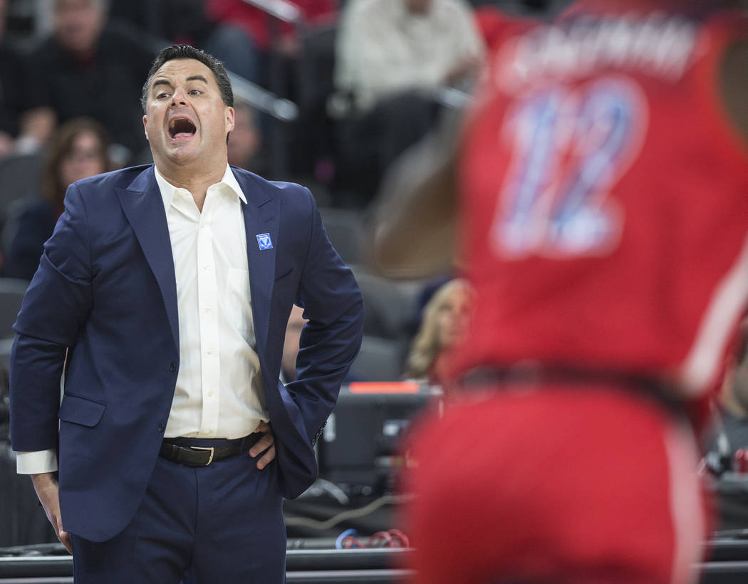 Arizona head coach Sean Miller, left, argues a call in the first half during the Wildcats Pac-12 tournament game with USC on Wednesday, March 13, 2019, at T-Mobile Arena, in Las Vegas. (Benjamin H ...