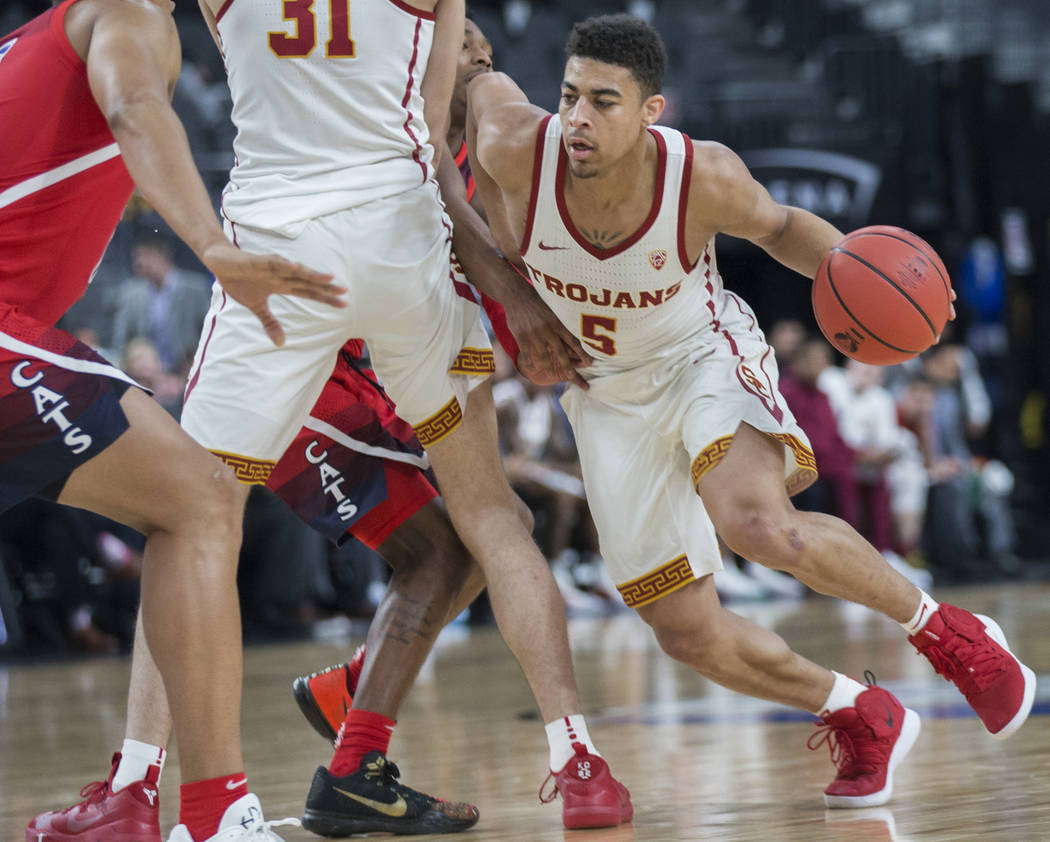 USC junior guard Derryck Thornton (5), a Findlay Prep graduate, turns the corner past an Arizona defender in the first half during the Pac-12 tournament on Wednesday, March 13, 2019, at T-Mobile A ...