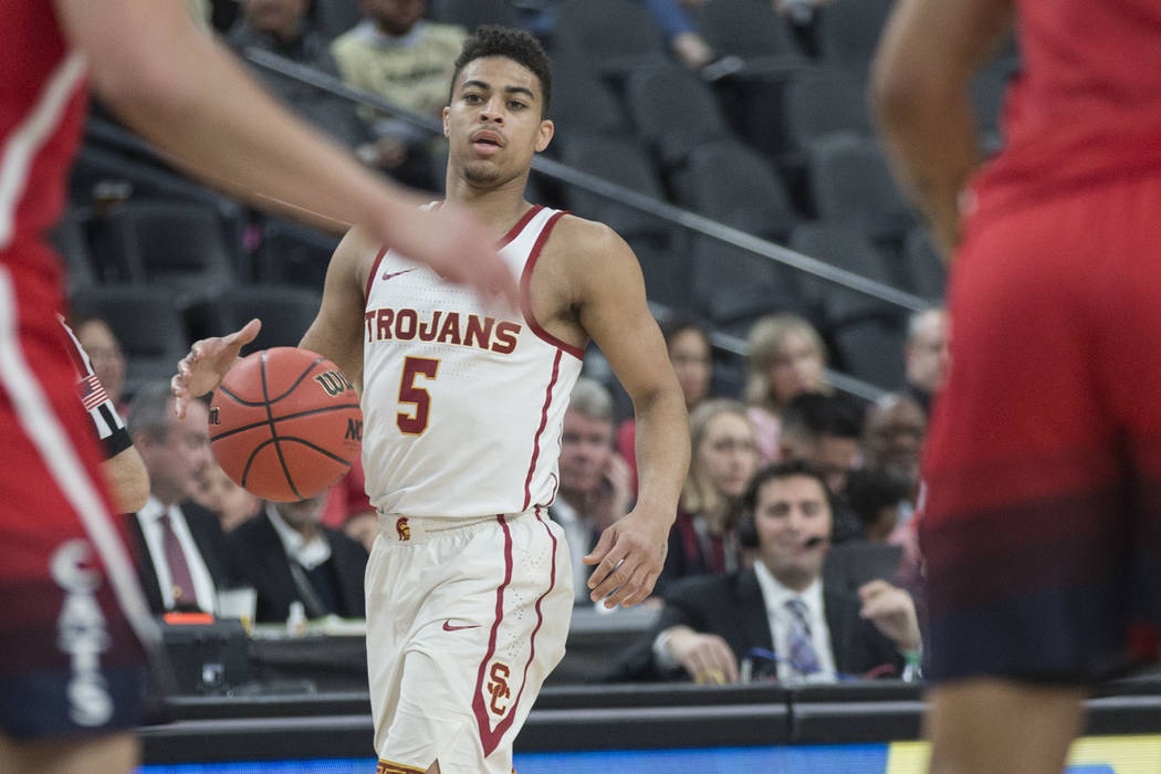 USC junior guard Derryck Thornton (5), a Findlay Prep graduate, sets up the Trojan offense in the first half during their Pac-12 tournament game with Arizona on Wednesday, March 13, 2019, at T-Mob ...