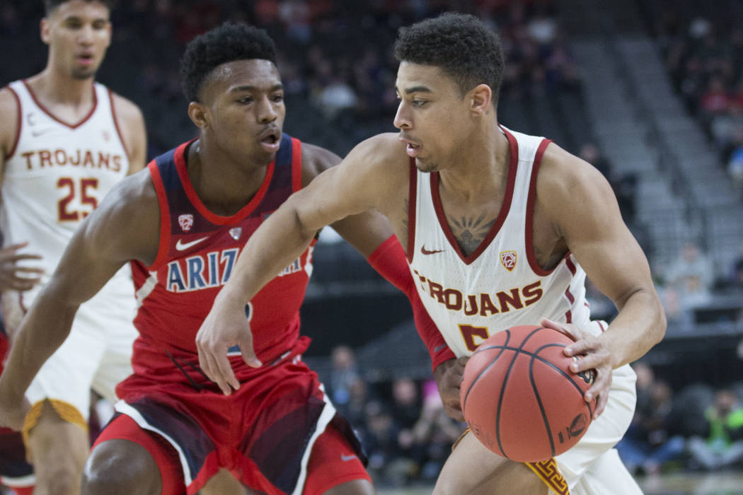 USC junior guard Derryck Thornton (5), a Findlay Prep graduate, drives past Arizona freshman guard Brandon Williams (2) in the first half during the Pac-12 tournament on Wednesday, March 13, 2019, ...