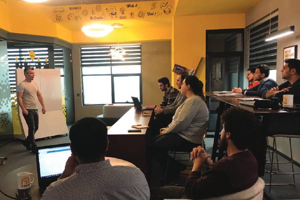 John Unal talks about business plan training to early stage startups at a co-working space in Istanbul in December 2018. (courtesy)