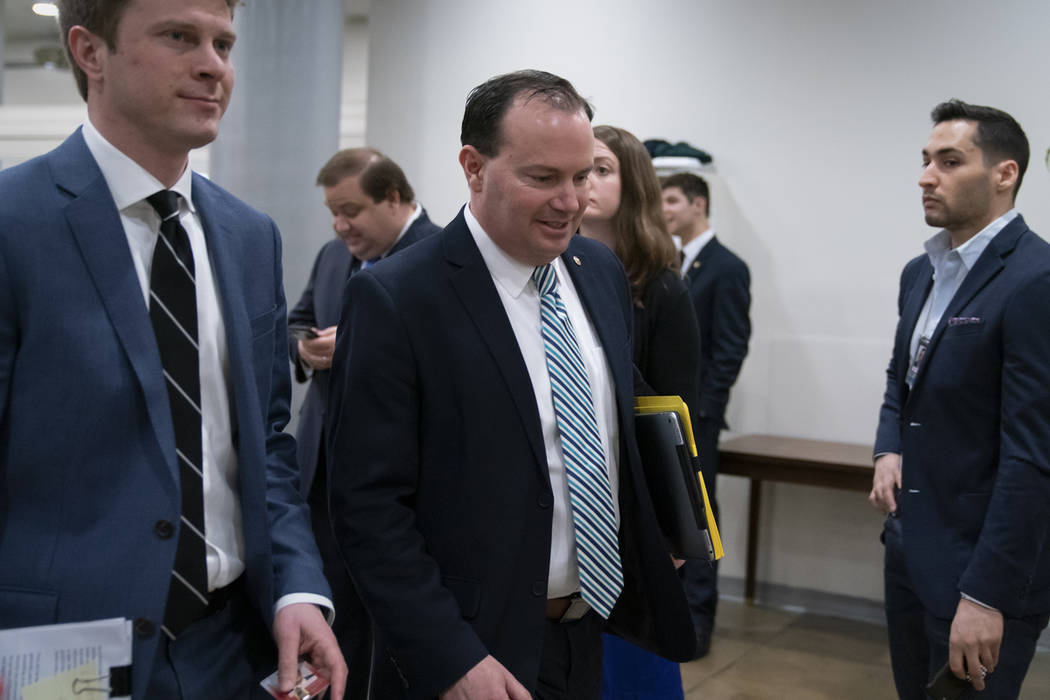 Sen. Mike Lee, R-Utah, walks to the chamber as an 11th-hour Republican rescue mission to keep President Donald Trump from a Senate defeat on his signature issue of building barriers along the sout ...