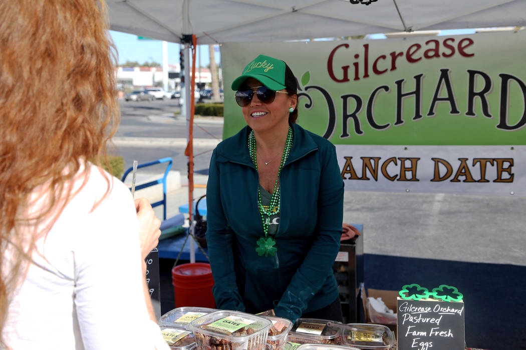 Carrie Hogan, founder of the Fresh52 farmers and artisans market, speaks to Sydney Ramsdell at the Fresh52 farmers and artisans market in Las Vegas, Sunday, March 17, 2019. (Rachel Aston/Las Vega ...