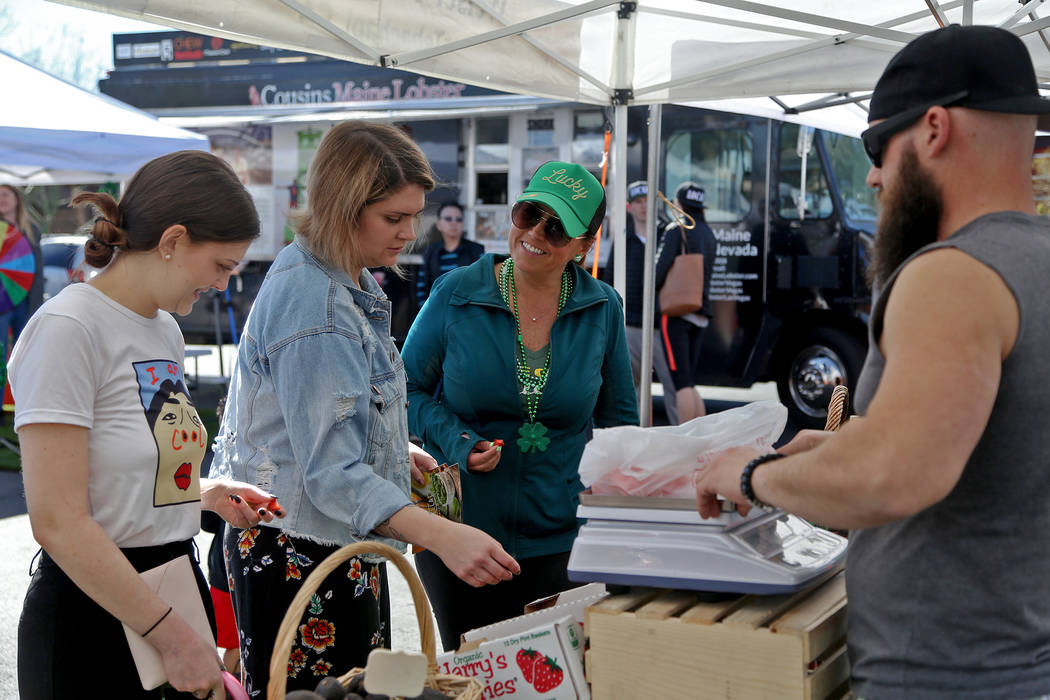 Carrie Hogan, founder of the Fresh52 farmers and artisans market, center, speaks to Jessica Dodd at the Fresh52 farmers and artisans market in Las Vegas, Sunday, March 17, 2019. (Rachel Aston/Las ...