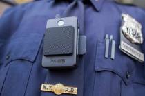 In this April 27, 2017 file photo, a police officer wears a newly-issued body camera outside in New York. In 2018, the New York City Police Department, the nation’s largest, stopped releasing bo ...