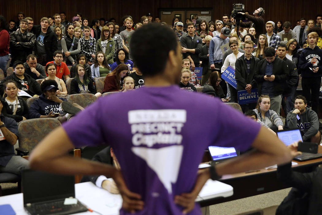 In this Feb. 20, 2016 file photo a precinct captain argues his position during a Democratic caucus at the University of Nevada in Reno, Nev. (AP Photo/Marcio Jose Sanchez,File)