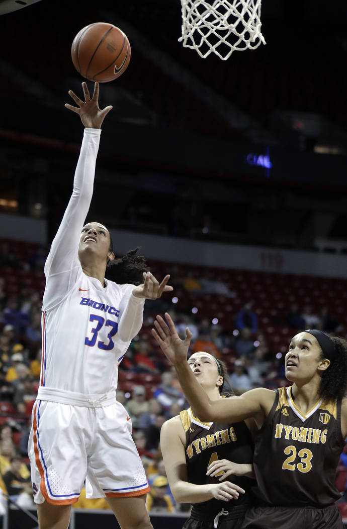 Boise State's bench reacts after Jayde Christopher sank a 3-point shot against Wyoming during the second half of an NCAA college basketball game for the Mountain West Conference women's tournament ...