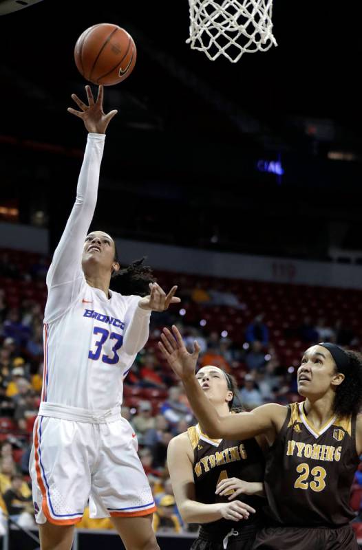 Boise State's bench reacts after Jayde Christopher sank a 3-point shot against Wyoming during the second half of an NCAA college basketball game for the Mountain West Conference women's tournament ...