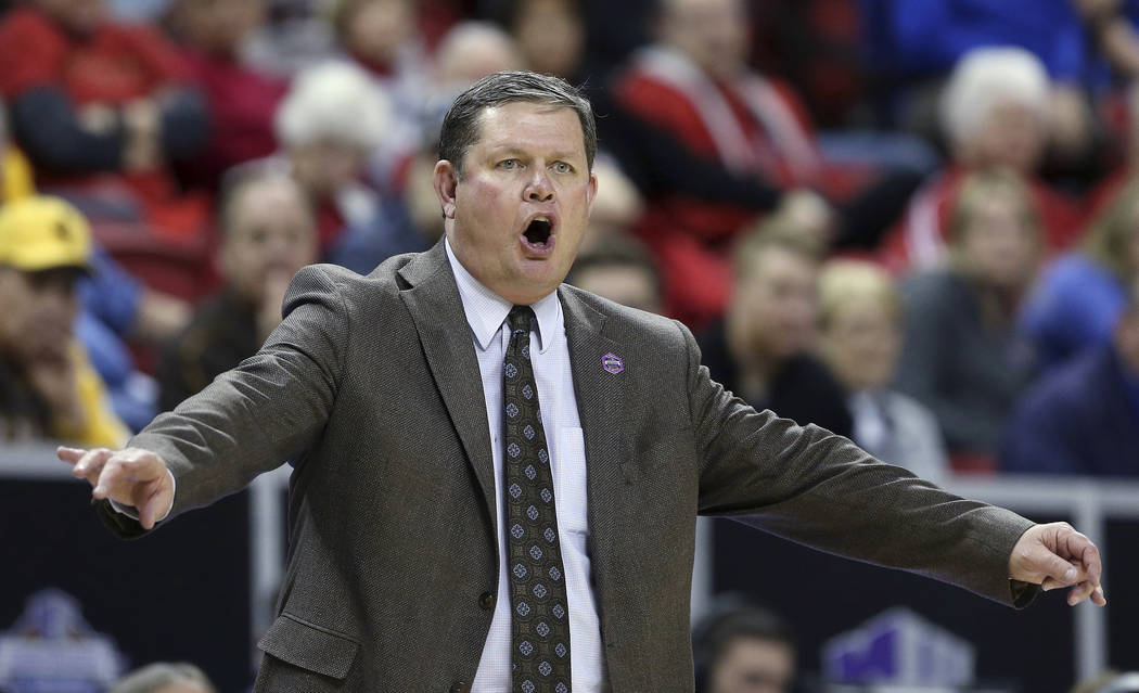 Wyoming coach Joe Legerski shouts to the team during the first half of an NCAA college basketball game against Boise State for the Mountain West Conference women's tournament championship Wednesda ...