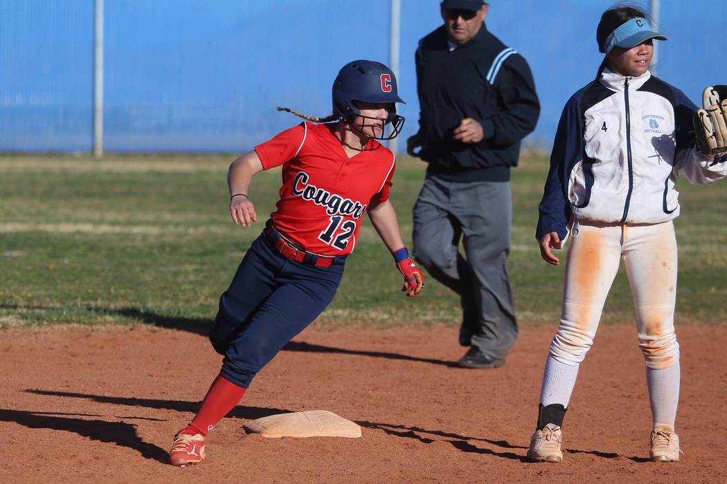 Coronado's Paige Sinicki (12) runs safe to second base against Centennial's Samantha Lawrence (4) in the softball game at Centennial High School in Las Vegas, Wednesday, March 13, 2019. Erik Verdu ...