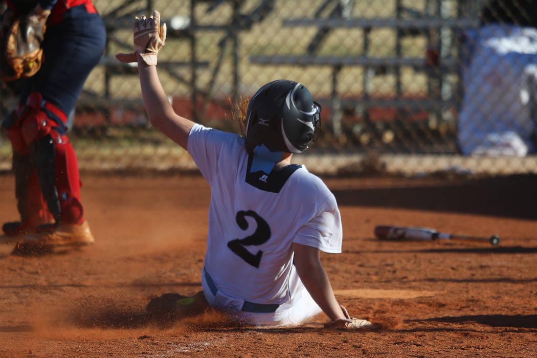 Centennial's Ryan Rogers (2) slides home for a run against Coronado in the softball game at Centennial High School in Las Vegas, Wednesday, March 13, 2019. Erik Verduzco Las Vegas Review-Journal @ ...