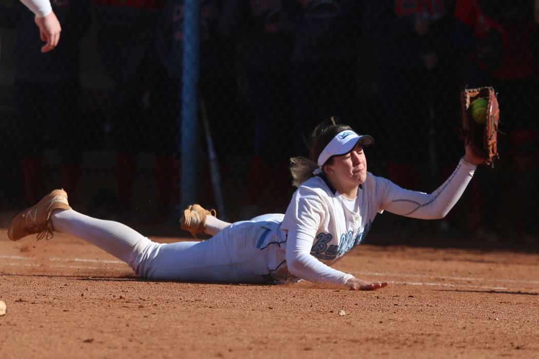 Centennial's Tatum Huntly (9) makes a diving catch for an out against Coronado in the softball game at Centennial High School in Las Vegas, Wednesday, March 13, 2019. Erik Verduzco Las Vegas Revie ...