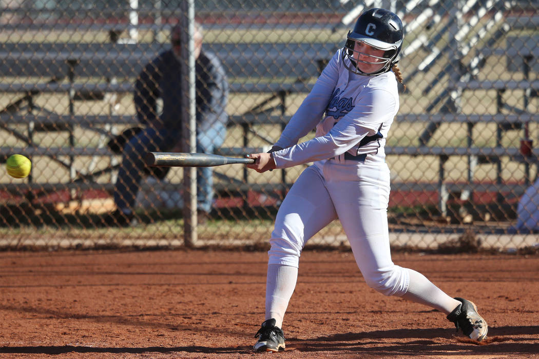 Centennial's Ashlynn Heck (8) hits the ball against Coronado in the softball game at Centennial High School in Las Vegas, Wednesday, March 13, 2019. Erik Verduzco Las Vegas Review-Journal @Erik_Ve ...