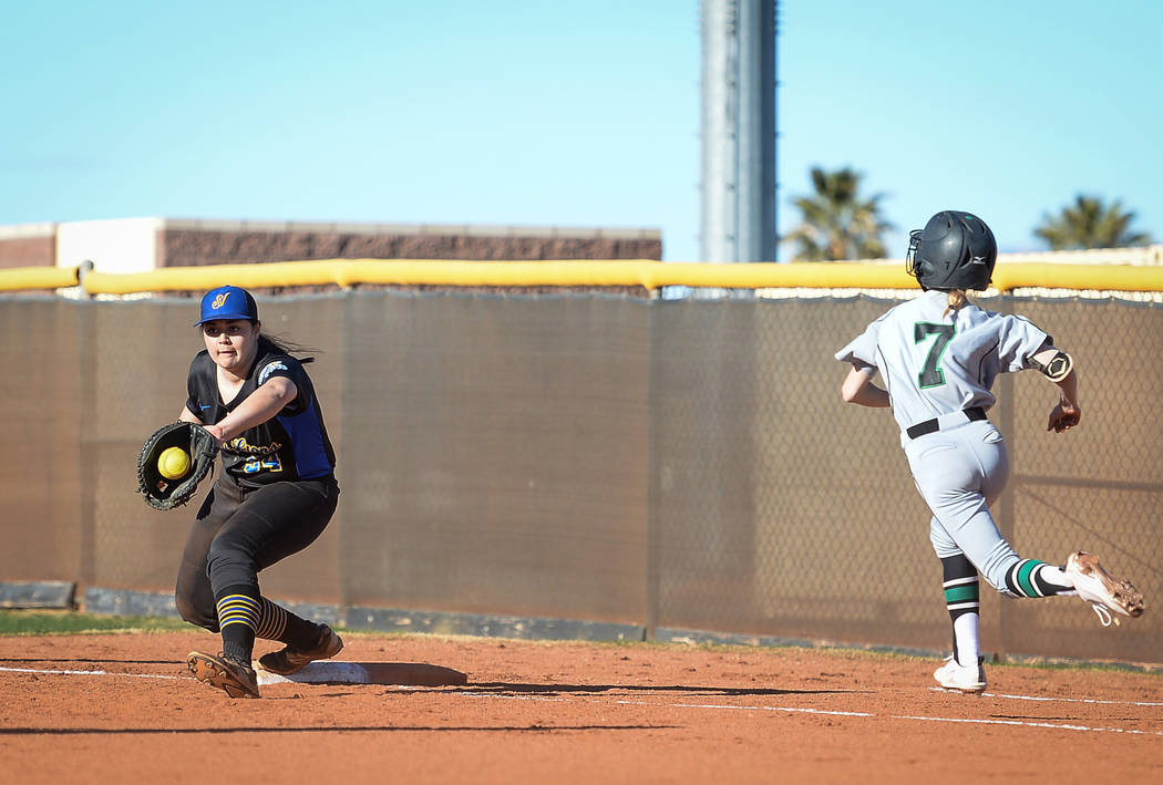 Sierra Vista's Mia Buranamontri (54) catches the ball as Palo Verde's Kendall Menke (7) runs to first base in the first inning of a softball game against at Sierra Vista High School in Las Vegas ...