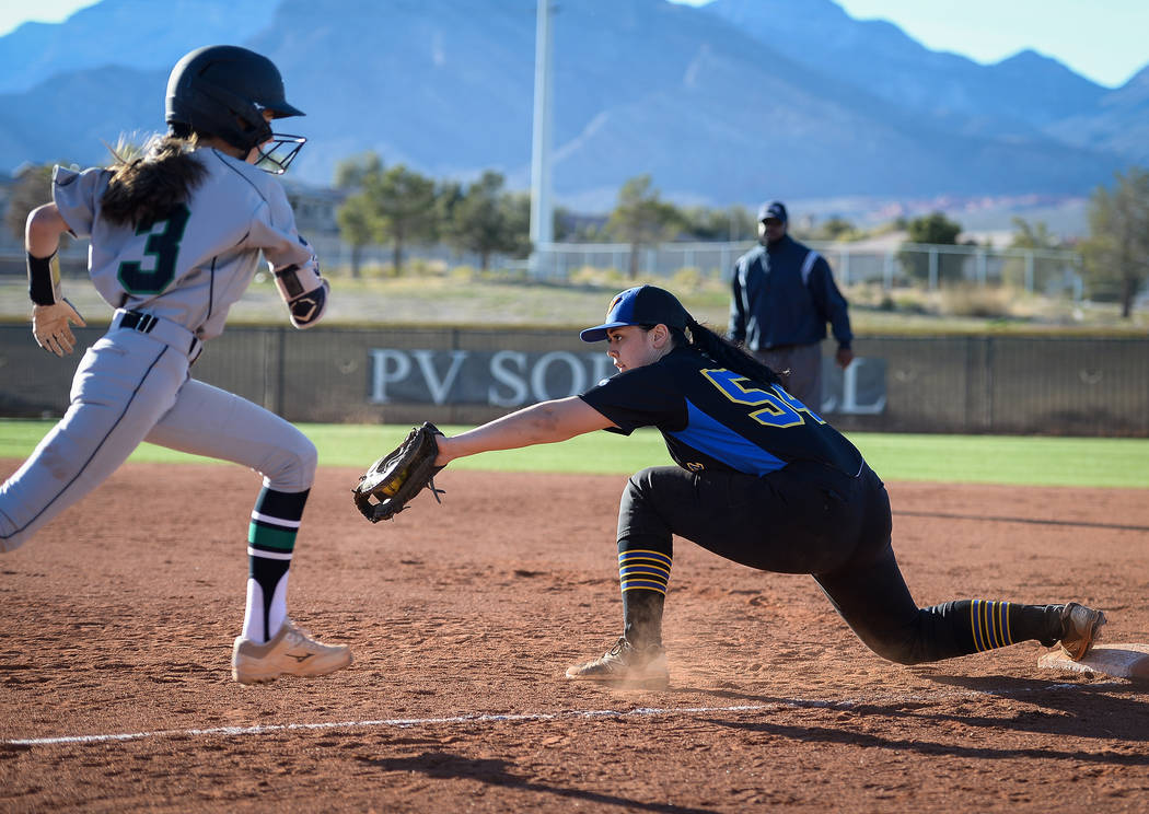 Sierra Vista's Mia Buranamontri (54) catches the ball to get out Palo Verde's Olivia Millsop (3) in the sixth inning of a softball game against at Palo Verde High School in Las Vegas, Thursday, Ma ...