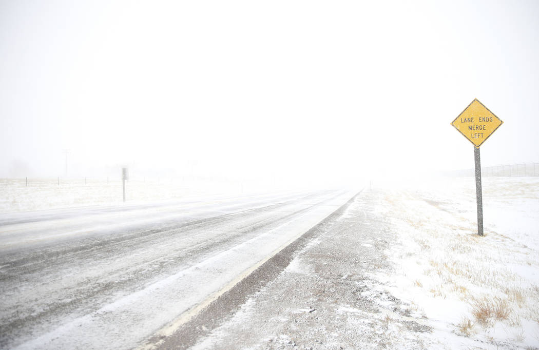 White-out conditions along Happy Jack Road during a blizzard on Wednesday, March 13, 2019, in Cheyenne. White-out conditions closed I-80, I-25, and U.S. 85, effectively closing off the state capit ...