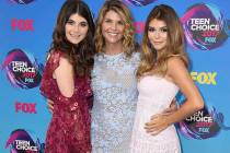 In this Aug. 13, 2017 file photo, actress Lori Loughlin, center, poses with her daughters Bella, left, and Olivia Jade at the Teen Choice Awards in Los Angeles. (Photo by Jordan Strauss/Invision/ ...