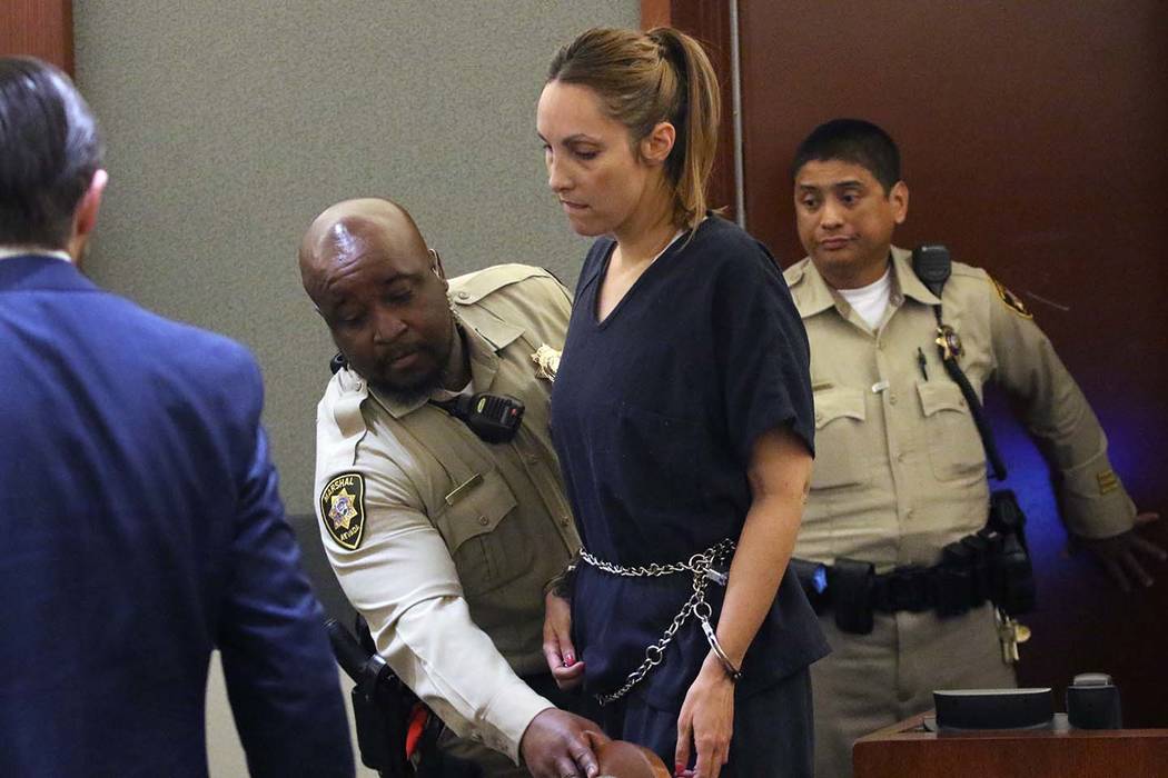 Alexis Plunkett, the jailed Las Vegas defense lawyer, is led into the courthouse during her bail hearing as her defense attorney Adam Solinger, left, looks on at the Regional Justice Center on Thu ...