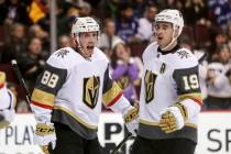 Vegas Golden Knights' Nate Schmidt (88) celebrates his goal with teammate Reilly Smith (19) during the second period of an NHL hockey game in Vancouver, British Columbia, Saturday, March 9, 2019. ...