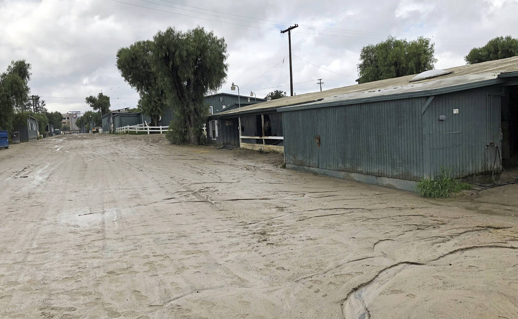 A stable area that would normally be bustling with horses going to and coming from workouts is quiet at Santa Anita Park in Arcadia, Calif., Thursday, March 7, 2019. Extensive testing of the dirt ...