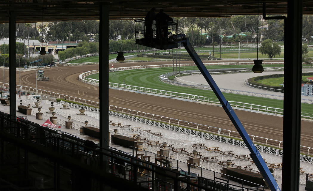 The Clockers' Corner area, the popular morning hangout for owners, trainers, jockeys and fans to watch workouts and grab breakfast, is empty at Santa Anita Park in Arcadia, Calif., Thursday, March ...