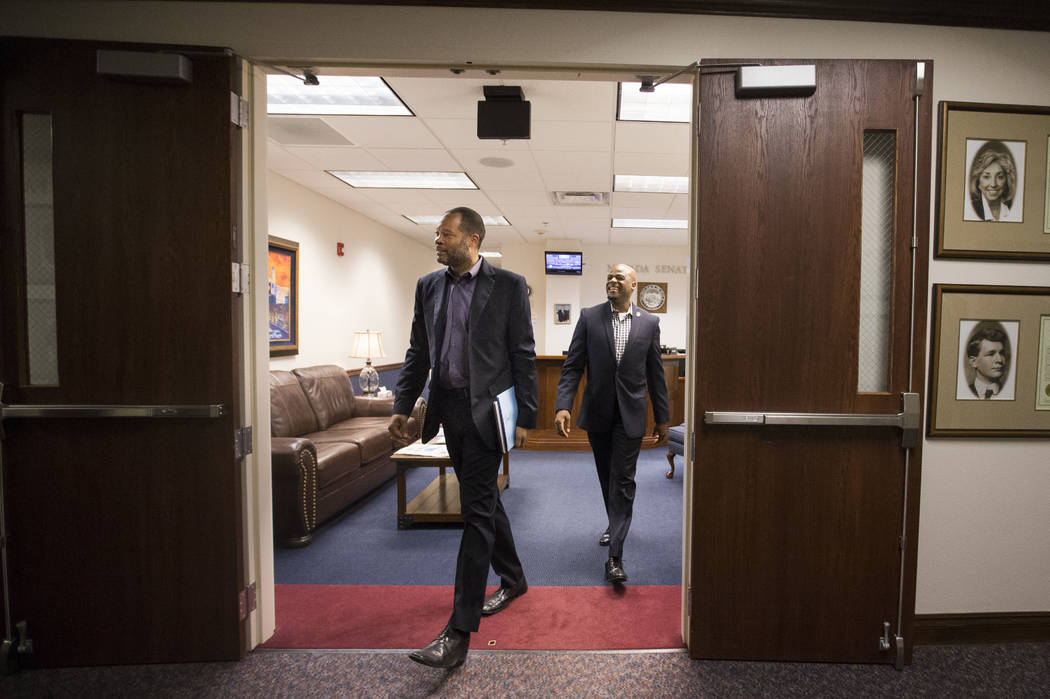 Senate Majority Leader Aaron Ford, D-Las Vegas, left, and Sen. Kelvin Atkinson, D-North Las Vegas, during the second to last day of the Nevada Legislature at the Legislative Building in Carson Cit ...