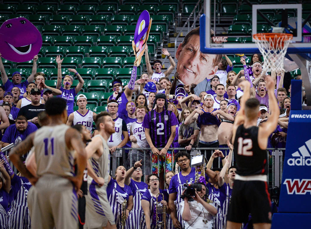 Fans in the Grand Canyon University student section attempt to distract Seattle University during a penalty shot in the second half of the opening round of the Western Athletic Conference tourname ...