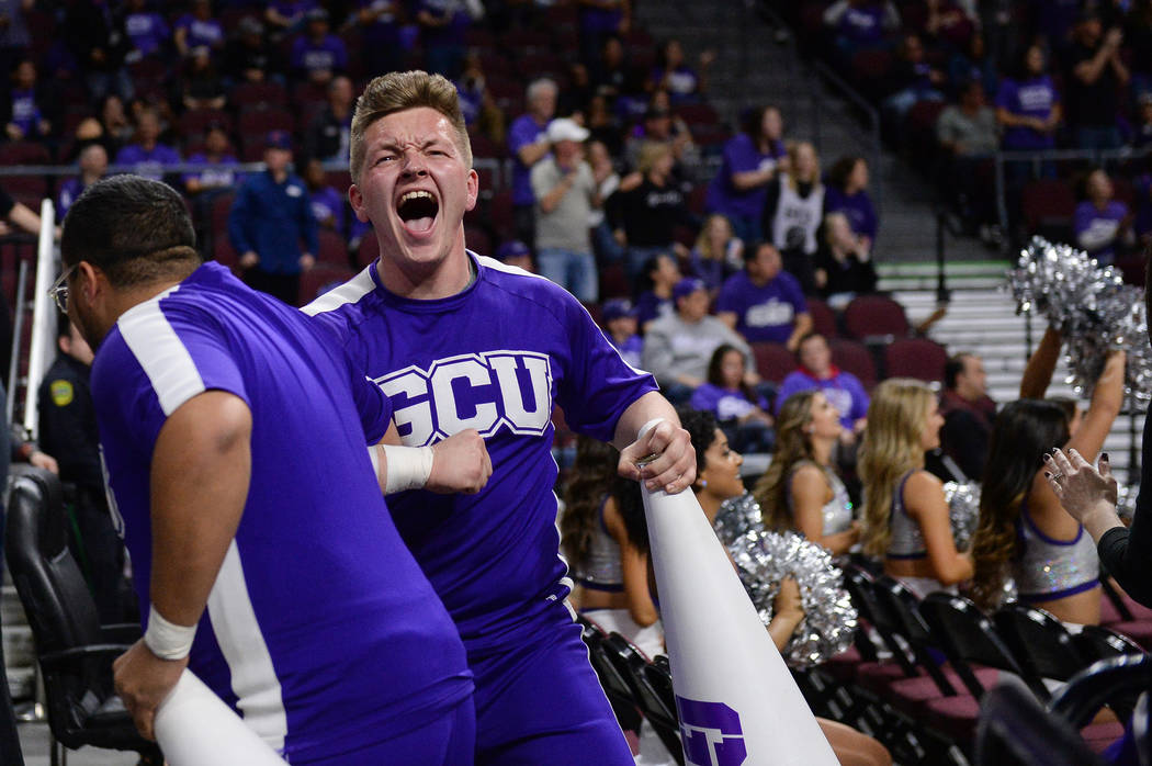 Grand Canyon University student Grayson Higgins cheers on the team in the second half of the opening round of the Western Athletic Conference tournament against Seattle University in Las Vegas, Th ...