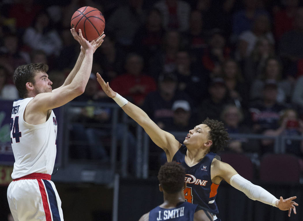 Gonzaga sophomore forward Corey Kispert (24) shoots a corner three over Pepperdine sophomore guard Colbey Ross (4) in the second half during the West Coast Conference semifinal game on Monday, Mar ...